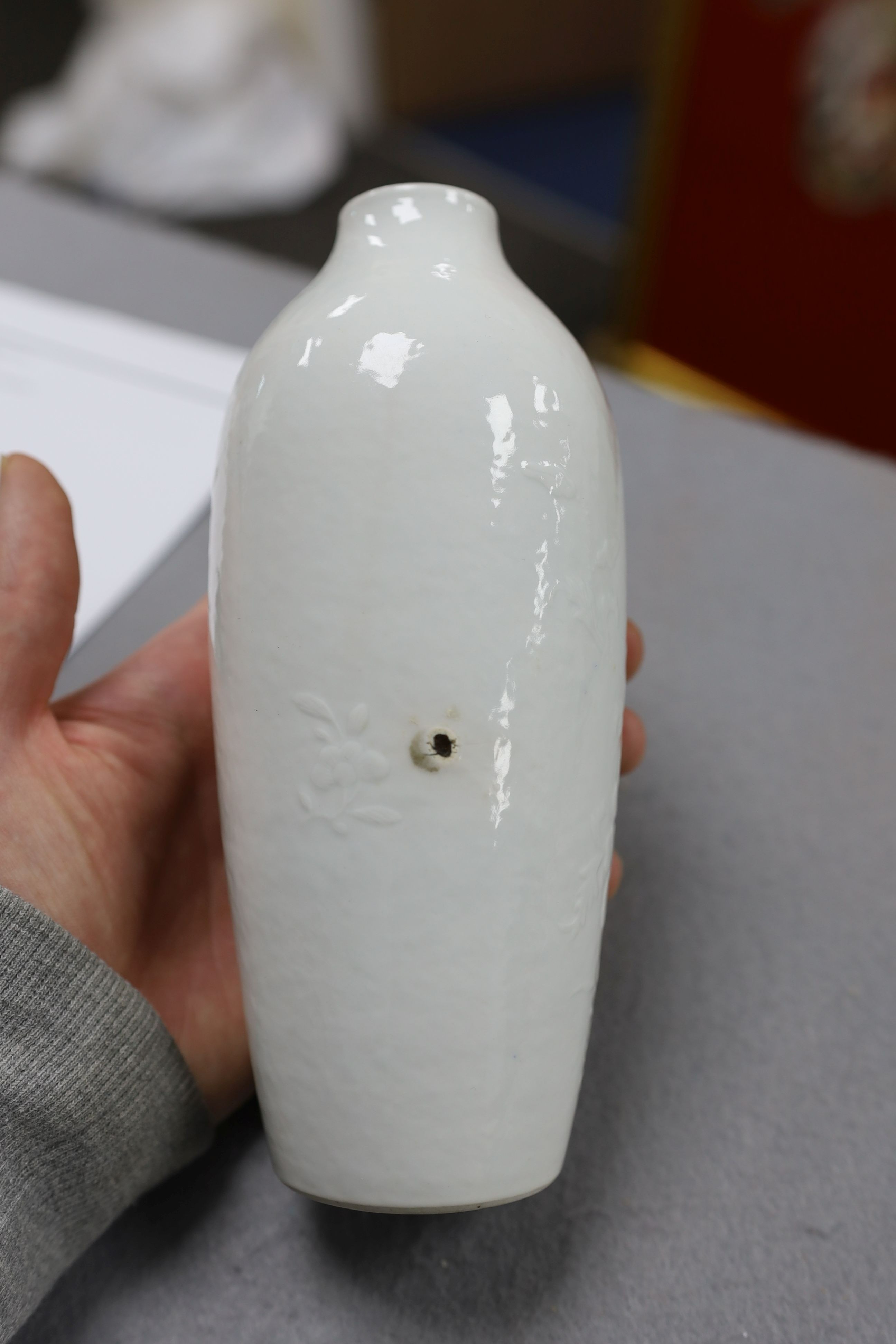 A Chinese moulded white glazed vase, Qianlong period, 18.3cm high, glaze blemish